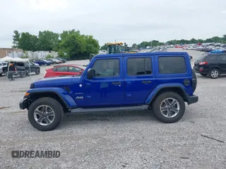 2019 Jeep Wrangler Unlimited Sahara with VIN 1C4HJXEG1KW599117, listed as a IAAI auction lot 42602241 with 109,552 mi miles and . Bid and sale history available at DreamBid. Image 14.