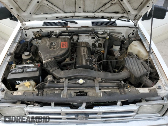 1990 Nissan Frontier z VIN 1N6SD11S8LC377906, wystawiony jako Copart lot #54840925 z przebiegiem 131 024 mil mil oraz Szkoda całkowita • Salvage title. Historia ofert i sprzedaży dostępna na DreamBid. Obrazek 11.
