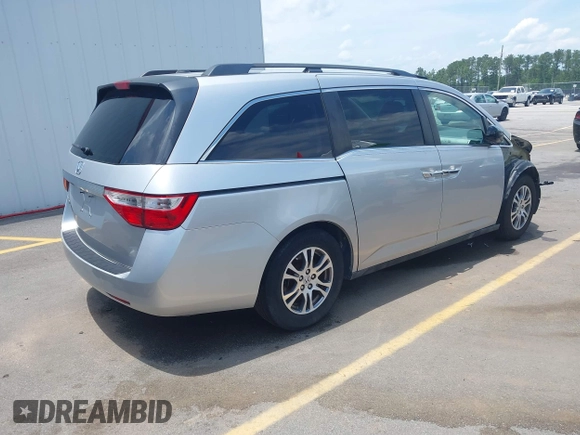 2012 Honda Odyssey EX-L with VIN 5FNRL5H65CB076534, listed as a IAAI auction lot 42440258 with 150,866 mi miles and . Bid and sale history available at DreamBid. Image 4.