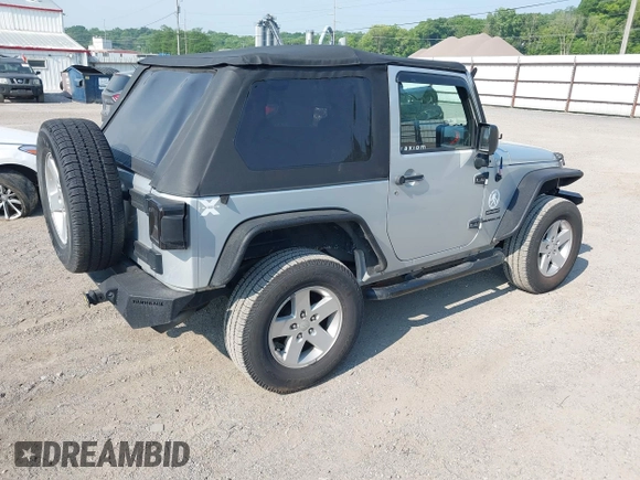 2012 Jeep Wrangler Sport z VIN 1C4AJWAG9CL255278, wystawiony jako IAAI lot #42469091 z przebiegiem 140 480 mil mil oraz . Historia ofert i sprzedaży dostępna na DreamBid. Obrazek 4.