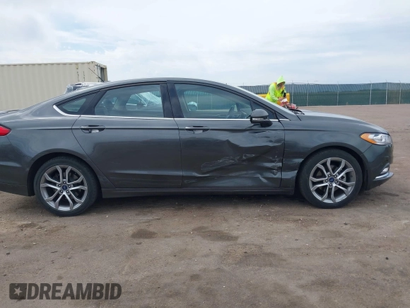 2017 Ford Fusion SE z VIN 3FA6P0H76HR354078, wystawiony jako IAAI lot #42103550 z przebiegiem 103 201 mil mil oraz . Historia ofert i sprzedaży dostępna na DreamBid. Obrazek 13.