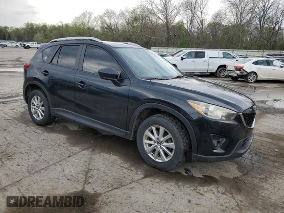 2014 Mazda CX-5 Touring with VIN JM3KE2CY8E0424757, listed as a Copart auction lot 54703195 with 111,401 mi miles and Salvage Title. Bid and sale history available at DreamBid. Image 4.