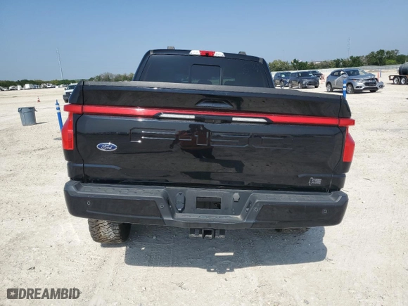 2023 Ford F-150 Lightning Pro with VIN 1FT6W1EV1PWG09284, listed as a Copart auction lot 49773755 with 15,207 mi miles and Salvage Title. Bid and sale history available at carsss.com. Image 6.