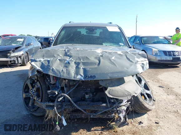 2019 Jeep Grand Cherokee Laredo E with VIN 1C4RJFAG2KC611457, listed as a IAAI auction lot 42212982 with 97,603 mi miles and . Bid and sale history available at DreamBid. Image 12.