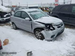 2011 Kia Rio LX with VIN KNADH4A39B6747734, listed as a IAAI auction lot 41288706 with 158,288 mi miles. Bid and sale history available at carsss.com. Image 1.