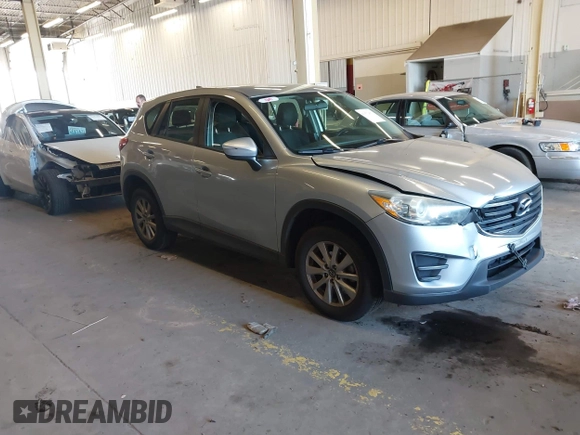 2016 Mazda CX-5 Sport with VIN JM3KE2BE5G0720507, listed as a IAAI auction lot 41872003 with 160,727 mi miles and . Bid and sale history available at carsss.com. Image 1.
