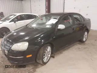 2008 Volkswagen Jetta z VIN 3VWRA71K58M183060, wystawiony jako IAAI lot #41700707 z przebiegiem 174 555 mil mil oraz . Historia ofert i sprzedaży dostępna na DreamBid. Obrazek 2.