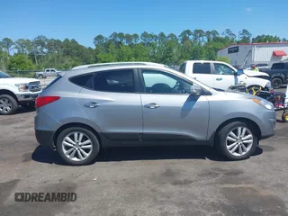 2013 Hyundai Tucson GLS with VIN KM8JU3AC4DU588062, listed as a IAAI auction lot 42080348 with 76,937 mi miles. Bid and sale history available at carsss.com. Image 13.