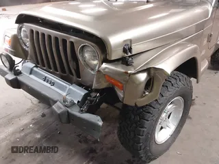 2004 Jeep Wrangler Sahara with VIN 1J4FA59S64P736389, listed as a IAAI auction lot 41432819 with 102,830 mi miles and . Bid and sale history available at DreamBid. Image 6.