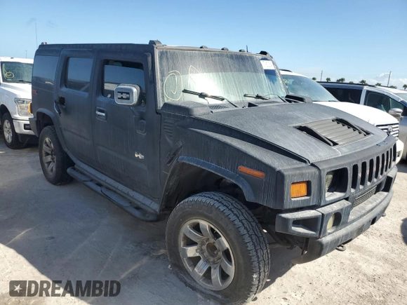 2003 Hummer H2 with VIN 5GRGN23U13H143781, listed as a Copart auction lot 77833264 with 0 mi miles and Salvage Title. Bid and sale history available at carsss.com. Image 4.