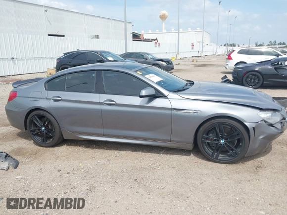 2014 BMW 6 Series 650i z VIN WBA6B2C55ED128934, wystawiony jako IAAI lot #42070641 z przebiegiem 102 597 mil mil oraz . Historia ofert i sprzedaży dostępna na DreamBid. Obrazek 13.