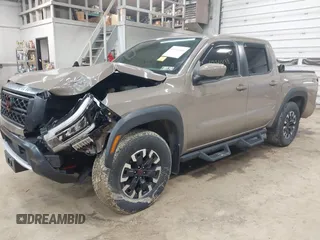 2024 Nissan Frontier SV with VIN 1N6ED1EK8RN613989, listed as a IAAI auction lot 42310148 with 14,202 mi miles and . Bid and sale history available at DreamBid. Image 2.