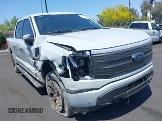 2023 Ford F-150 Lightning Pro with VIN 1FTVW1EL3PWG20829, listed as a IAAI auction lot 42357162 with 52,553 mi miles and . Bid and sale history available at DreamBid. Image 1.