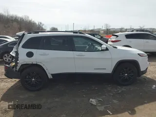 2014 Jeep Cherokee Latitude with VIN 1C4PJMCB1EW301011, listed as a IAAI auction lot 41777745 with 133,643 mi miles and . Bid and sale history available at DreamBid. Image 13.