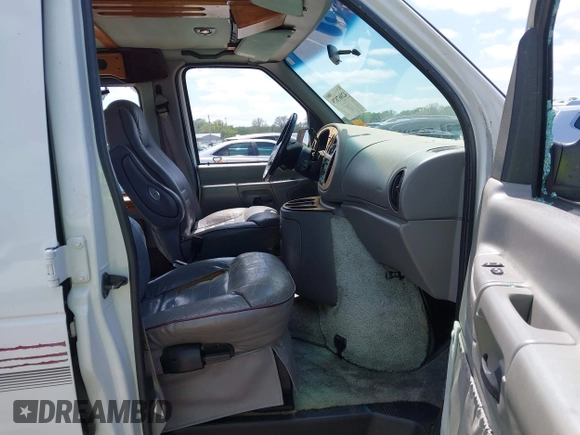 1999 Ford Econoline Cargo Recreational with VIN 1FDRE14L2XHA41059, listed as a IAAI auction lot 42067879 with 149,185 mi miles. Bid and sale history available at carsss.com. Image 5.