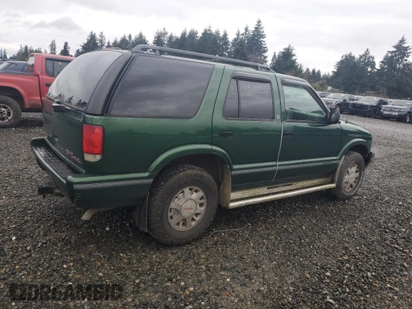 1997 GMC Jimmy SLS with VIN 1GKDT13WXV2563104, listed as a Copart auction lot 86317834 with 121,791 mi miles and Salvage Title. Bid and sale history available at carsss.com. Image 3.