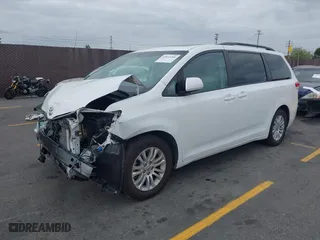 2014 Toyota Sienna XLE with VIN 5TDYK3DCXES470852, listed as a IAAI auction lot 42053266 with 48,512 mi miles. Bid and sale history available at carsss.com. Image 2.