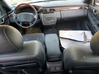 2002 Cadillac DeVille DHS z VIN 1G6KE57Y02U304933, wystawiony jako Copart lot #86919134 z przebiegiem Nie podano mil oraz Czysty tytuł • Clean title. Historia ofert i sprzedaży dostępna na DreamBid. Obrazek 8.