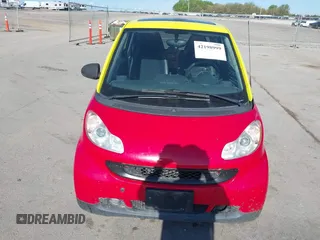 2009 Smart fortwo Pure z VIN WMEEJ31X99K290533, wystawiony jako IAAI lot #42198999 z przebiegiem 50 608 mil mil oraz . Historia ofert i sprzedaży dostępna na DreamBid. Obrazek 6.