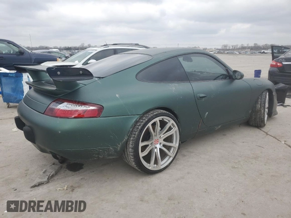 1999 Porsche 911 z VIN WP0AA299XXS623462, wystawiony jako Copart lot #85549554 z przebiegiem Nie podano mil oraz Szkoda całkowita • Salvage title. Historia ofert i sprzedaży dostępna na DreamBid. Obrazek 3.