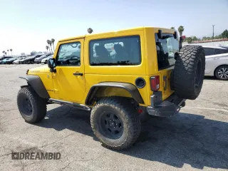 2015 Jeep Wrangler Rubicon Hard Rock with VIN 1C4BJWCG6FL568665, listed as a Copart auction lot 60282155 with 107,773 mi miles and Salvage title. Bid and sale history available at DreamBid. Image 2.