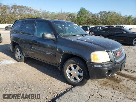 2004 GMC Envoy SLE with VIN 1GKDT13S042404250, listed as a Copart auction lot 52672455 with 230,610 mi miles and Salvage Title. Bid and sale history available at carsss.com. Image 4.
