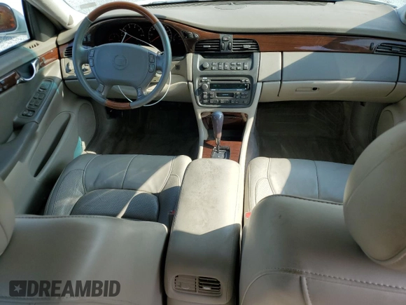 2003 Cadillac DeVille DTS z VIN 1G6KF57933U147843, wystawiony jako Copart lot #55875195 z przebiegiem 160 814 mil mil oraz Szkody całkowita. Historia ofert i sprzedaży dostępna na DreamBid. Obrazek 8.