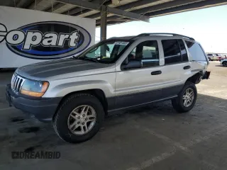 2003 Jeep Grand Cherokee Laredo z VIN 1J4GW48S23C617830, wystawiony jako Copart lot #57481565 z przebiegiem 122 745 mil mil oraz Szkoda całkowita • Salvage title. Historia ofert i sprzedaży dostępna na DreamBid. Obrazek 1.