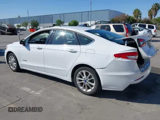 2019 Ford Fusion Hybrid SE with VIN 3FA6P0LU9KR207824, listed as a IAAI auction lot 42153330 with 69,966 mi miles. Bid and sale history available at carsss.com. Image 3.