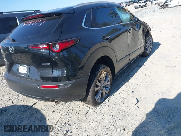 2023 Mazda CX-30 2.5 S Premium Package with VIN 3MVDMBDMXPM529797, listed as a IAAI auction lot 41012225 with 26,354 mi miles. Bid and sale history available at carsss.com. Image 4.