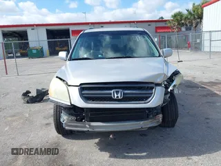 2003 Honda Pilot EX with VIN 2HKYF18603H504829, listed as a IAAI auction lot 42083247 with 247,429 mi miles and . Bid and sale history available at carsss.com. Image 6.