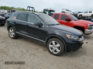 2012 Volkswagen Touareg Sport with VIN WVGFF9BP8CD001039, listed as a Copart auction lot 57764125 with 128,540 mi miles and Clean title. Bid and sale history available at DreamBid. Image 4.