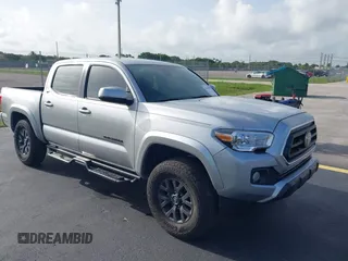 2022 Toyota Tacoma SR with VIN 3TYCZ5AN3NT101973, listed as a IAAI auction lot 42442537 with 20,727 mi miles and . Bid and sale history available at DreamBid. Image 1.