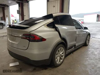 2018 Tesla Model X 75D with VIN 5YJXCDE28JF120932, listed as a IAAI auction lot 41899059 with 57,568 mi miles. Bid and sale history available at carsss.com. Image 4.