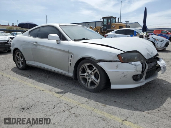 2006 Hyundai Tiburon GT z VIN KMHHN65F06U203701, wystawiony jako Copart lot #52374135 z przebiegiem 90 796 mil mil oraz Szkody całkowita. Historia ofert i sprzedaży dostępna na DreamBid. Obrazek 4.