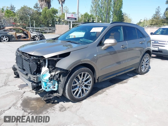 2020 Cadillac XT4 FWD Sport with VIN 1GYFZER4XLF032646, listed as a IAAI auction lot 42078928 with 11,987 mi miles and . Bid and sale history available at DreamBid. Image 2.
