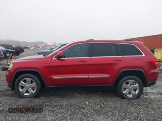 2013 Jeep Grand Cherokee Laredo with VIN 1C4RJEAG0DC516926, listed as a IAAI auction lot 41800254 with 259,006 mi miles. Bid and sale history available at carsss.com. Image 14.