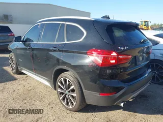 2018 BMW X1 sDrive28i with VIN WBXHU7C30J5L04913, listed as a IAAI auction lot 41755344 with 101,867 mi miles. Bid and sale history available at carsss.com. Image 3.