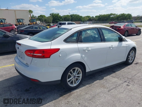 2015 Ford Focus SE with VIN 1FADP3F23FL329375, listed as a IAAI auction lot 42170945 with 114,180 mi miles. Bid and sale history available at carsss.com. Image 4.