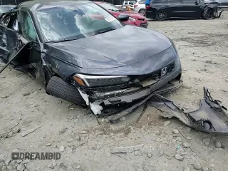 2024 Honda Civic LX z VIN 19XFL2H52RE017237, wystawiony jako Copart lot #56076635 z przebiegiem 20 999 mil mil oraz Szkoda całkowita • Salvage title. Historia ofert i sprzedaży dostępna na DreamBid. Obrazek 13.