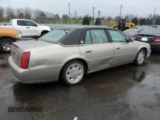 2004 Cadillac DeVille DTS z VIN 1G6KF57944U117834, wystawiony jako Copart lot #89320975 z przebiegiem 149 820 mil mil oraz Szkody całkowita. Historia ofert i sprzedaży dostępna na DreamBid. Obrazek 3.