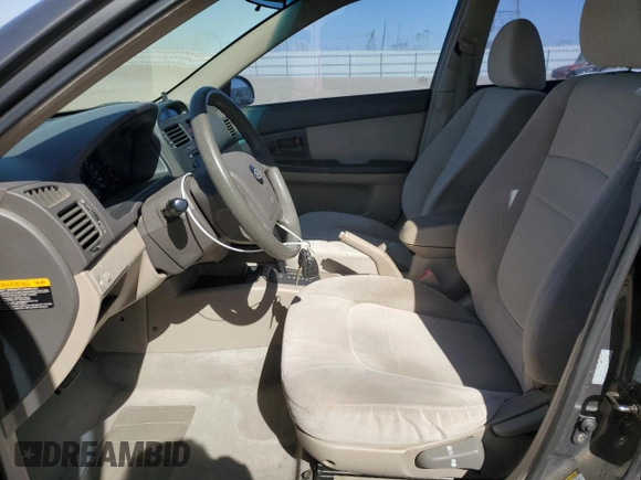2006 Kia Spectra EX with VIN KNAFE122X65277053, listed as a Copart auction lot 75697314 with 147,156 mi miles and Salvage Title. Bid and sale history available at carsss.com. Image 7.
