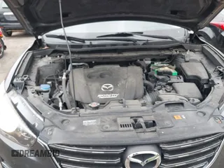 2016 Mazda CX-5 Sport with VIN JM3KE4BY9G0710004, listed as a IAAI auction lot 42323434 with 83,320 mi miles and . Bid and sale history available at DreamBid. Image 10.
