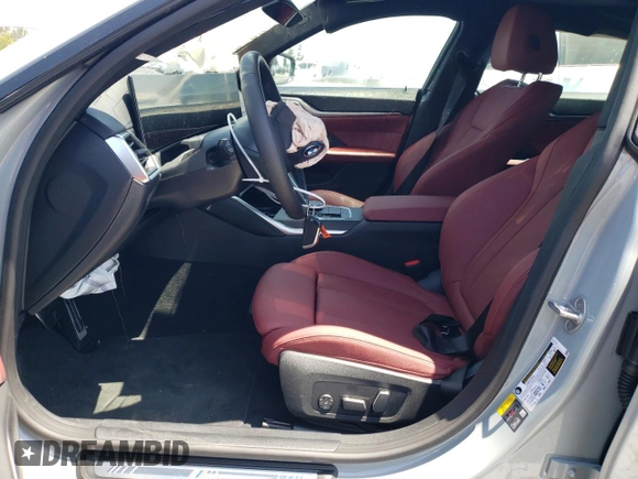 2024 BMW i4 eDrive35 with VIN WBY43AW06RFS94891, listed as a Copart auction lot 57983274 with 1,099 mi miles and Salvage Title. Bid and sale history available at carsss.com. Image 7.
