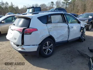 2018 Toyota RAV4 XLE with VIN JTMRFREV1JJ259705, listed as a IAAI auction lot 41779233 with 73,099 mi miles. Bid and sale history available at carsss.com. Image 4.