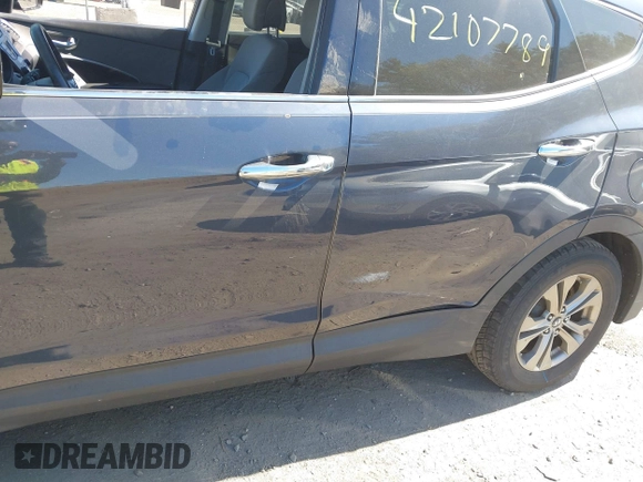 2014 Hyundai Santa Fe z VIN 5XYZUDLB1EG165458, wystawiony jako IAAI lot #42107789 z przebiegiem 94 395 mil mil oraz . Historia ofert i sprzedaży dostępna na DreamBid. Obrazek 6.