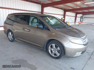 2011 Honda Odyssey Touring with VIN 5FNRL5H92BB086320, listed as a IAAI auction lot 41889872 with 103,027 mi miles. Bid and sale history available at carsss.com. Image 1.