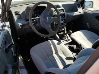 1991 Geo Tracker z VIN 2CNBJ18U3M6909006, wystawiony jako Copart lot #73638944 z przebiegiem 65 033 mil mil oraz Tytuł czysty. Historia ofert i sprzedaży dostępna na DreamBid. Obrazek 8.