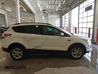 2017 Ford Escape SE z VIN 1FMCU0GD3HUC12658, wystawiony jako IAAI lot #41801033 z przebiegiem 107 662 mil mil oraz . Historia ofert i sprzedaży dostępna na DreamBid. Obrazek 13.