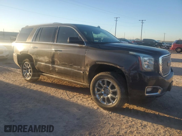 2015 GMC Yukon Denali with VIN 1GKS1CKJ7FR132677, listed as a Copart auction lot 82118584 with 144,798 mi miles and Salvage Title. Bid and sale history available at carsss.com. Image 4.